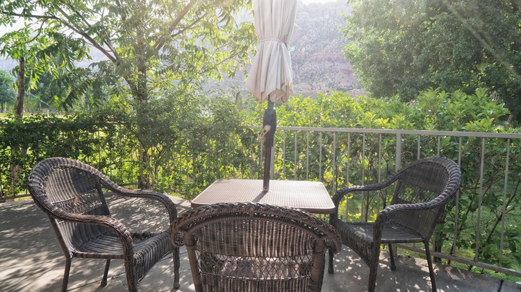 Patio with table and three chairs